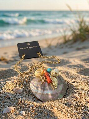 Banana Republic mother of pearl seashell with charms on a gold chain